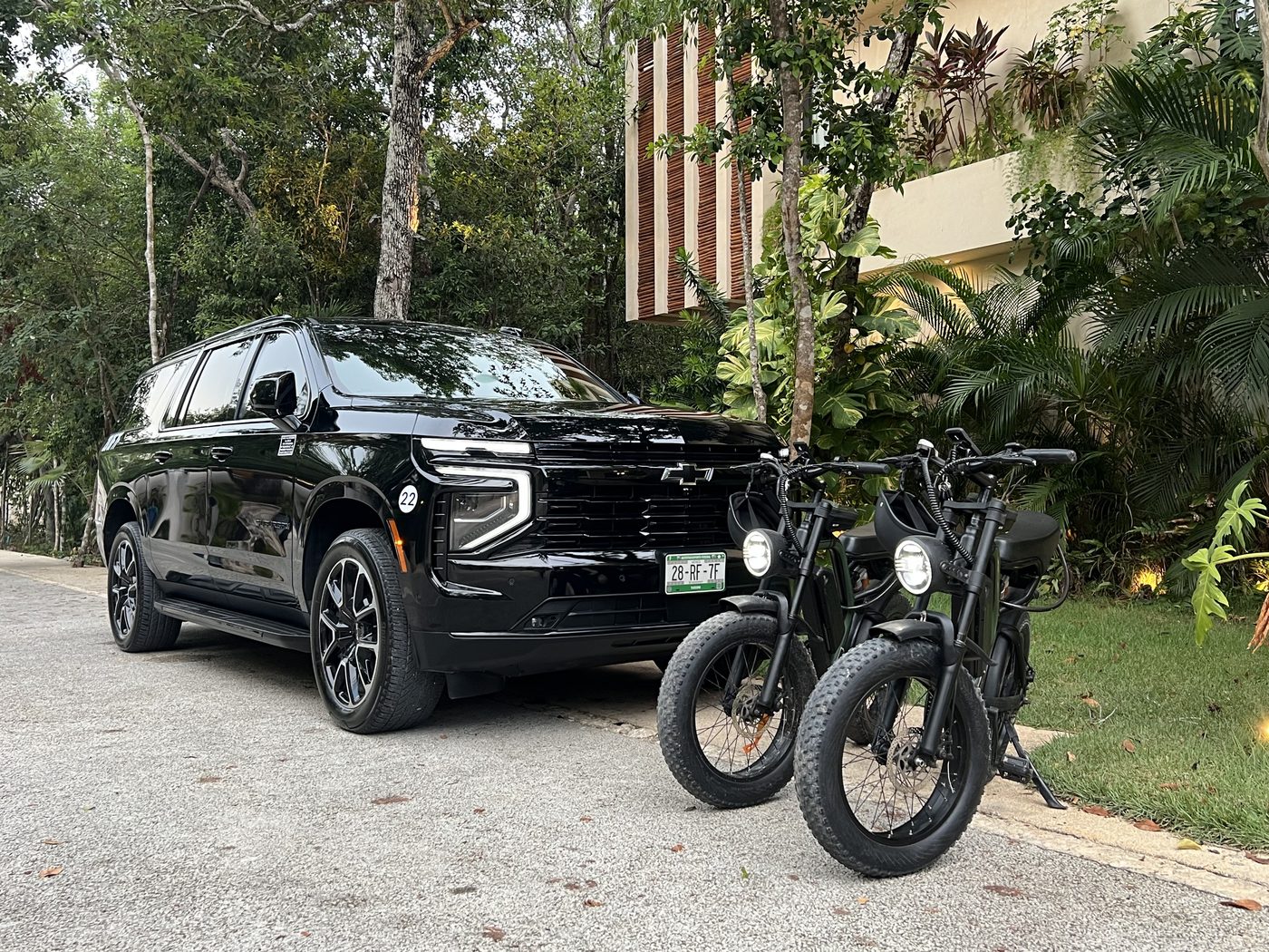 Delivery vehicle and e-bikes at a Tulum villa